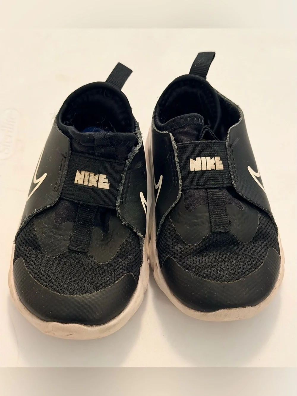 Nike Toddler Black and White Slip-On Sneakers